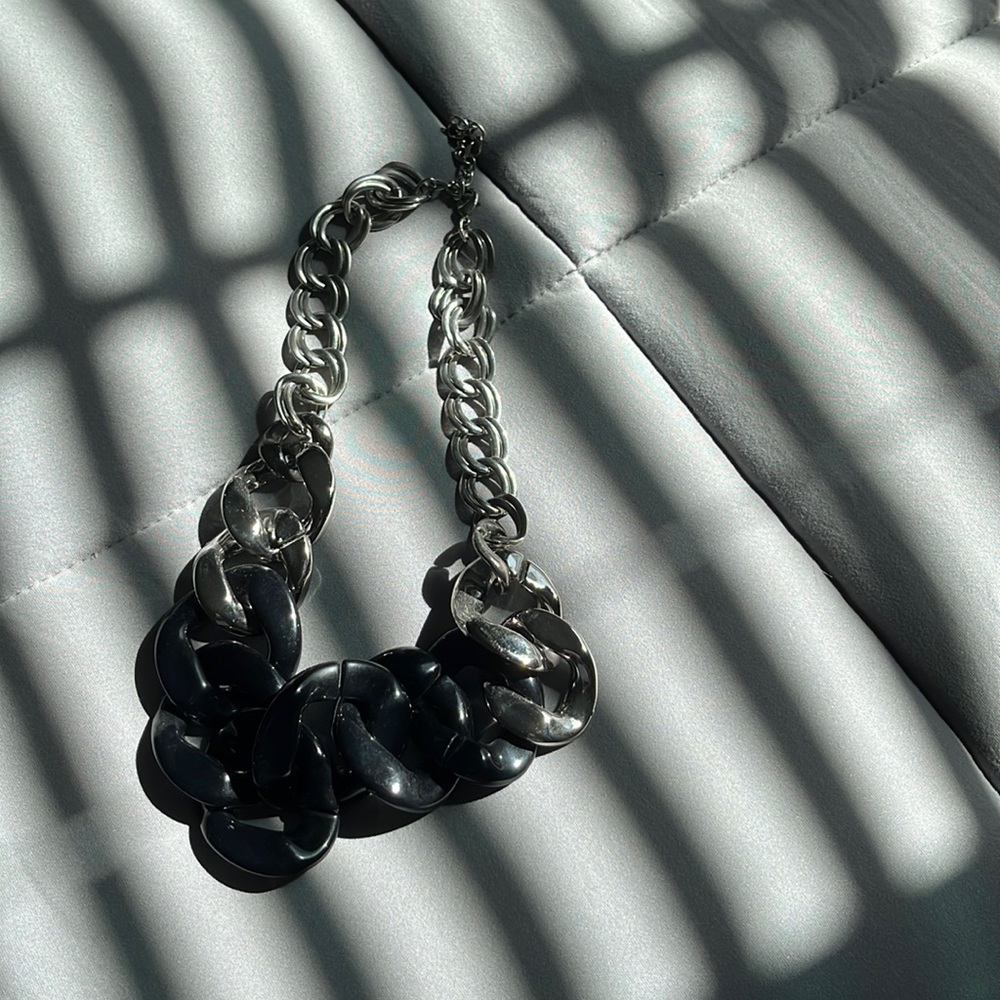 silver and black thick necklace